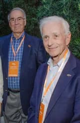 Two delegates chatting at an evening reception